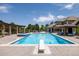 Expansive swimming pool with a diving board, spa, outdoor dining, and various seating areas, ideal for entertaining at 4041 E Forbes Ct, Greenwood Village, CO 80121