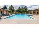 Inviting swimming pool with an attached spa, a poolside pergola, and lounge chairs for ultimate relaxation and enjoyment at 4041 E Forbes Ct, Greenwood Village, CO 80121