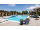 Large rectangular pool with a diving board, a spa, an outdoor kitchen, and lounge seating for relaxation at 4041 E Forbes Ct, Greenwood Village, CO 80121