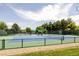 Well-maintained tennis courts surrounded by greenery and fencing, offering recreational opportunities at 4041 E Forbes Ct, Greenwood Village, CO 80121