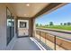 Enjoy the outdoors from this balcony with golf course views and a modern metal railing at 11475 E Briarwood Cir, Centennial, CO 80112