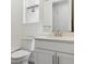Bright bathroom featuring a white vanity with modern fixtures at 11475 E Briarwood Cir, Centennial, CO 80112