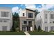Stunning modern home with a brick and gray exterior, complimented by well-manicured landscaping at 11475 E Briarwood Cir, Centennial, CO 80112