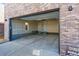 Spacious two-car garage with attached entry, providing ample parking and storage space at 11475 E Briarwood Cir, Centennial, CO 80112