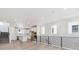 Bright, open living area with hardwood floors, stairs and modern railings at 11475 E Briarwood Cir, Centennial, CO 80112