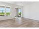 Spacious living room with hardwood floors and sliding door to balcony at 11475 E Briarwood Cir, Centennial, CO 80112