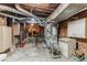 Unfinished basement with exposed brick, concrete floor, and visible ductwork at 2227 N Gilpin St, Denver, CO 80205