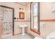 Bathroom featuring a walk-in shower, pedestal sink, a window, and vintage-style fixtures at 2227 N Gilpin St, Denver, CO 80205