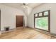 Cozy bedroom with hardwood floors, a large window, and a closet at 2227 N Gilpin St, Denver, CO 80205