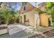 Exterior view of the property, featuring a patio, grill and access to the backyard at 2227 N Gilpin St, Denver, CO 80205