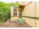Charming exterior with decorative window, green trim, and brick pathway leading to the entrance at 2227 N Gilpin St, Denver, CO 80205