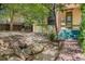 Charming front yard with stone features, lush greenery, and quaint entrance to a well-maintained home at 2227 N Gilpin St, Denver, CO 80205