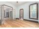 Spacious living room with hardwood floors, classic trim, and open doorways to adjoining rooms at 2227 N Gilpin St, Denver, CO 80205