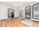 Bright and airy living room featuring hardwood floors, neutral paint, and ornate architectural details at 2227 N Gilpin St, Denver, CO 80205