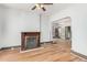 Inviting living room features a decorative fireplace, wood floors, and an open layout at 2227 N Gilpin St, Denver, CO 80205