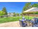 A spacious backyard featuring a patio with outdoor seating and a large lawn at 1093 Lilac Cir, Broomfield, CO 80020