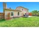 A well-maintained backyard featuring a stone patio and lush green lawn at 1093 Lilac Cir, Broomfield, CO 80020