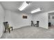 Spacious basement featuring neutral carpet, bright lighting, and a doorway at 1093 Lilac Cir, Broomfield, CO 80020