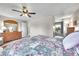 Well-lit bedroom showcasing carpet, a fan, neutral paint, and access to the en suite at 1093 Lilac Cir, Broomfield, CO 80020