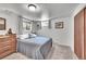 A cozy bedroom featuring a comfortable bed, a window, and natural light at 1093 Lilac Cir, Broomfield, CO 80020