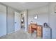 Inviting room featuring plush carpet, a desk, and a closet door at 1093 Lilac Cir, Broomfield, CO 80020