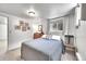 This bedroom has a cozy bed with carpet, a window, and is brightly lit at 1093 Lilac Cir, Broomfield, CO 80020