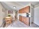Cozy dining area featuring tiled floors, wood cabinets, and access to a hallway and entrance at 1093 Lilac Cir, Broomfield, CO 80020
