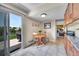 Bright dining area with a view to a patio, light wood cabinetry, and tiled floors at 1093 Lilac Cir, Broomfield, CO 80020