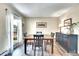 Cozy dining room with a wooden table, natural light from the windows, and wood flooring for Gathering meals at 1093 Lilac Cir, Broomfield, CO 80020