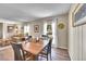 Inviting dining room with natural light, wood floors, and views into the living room, perfect for gatherings at 1093 Lilac Cir, Broomfield, CO 80020