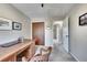 Office with plush carpet, a large desk, and a door at 1093 Lilac Cir, Broomfield, CO 80020