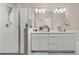 Bathroom features a glass-enclosed shower and double vanity with modern fixtures at 193 Ambrose St, Erie, CO 80516