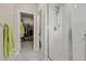 Bathroom showcases a glass shower with a double shower head, closet, and adjoining bathroom at 193 Ambrose St, Erie, CO 80516