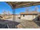 Backyard featuring a storage shed and privacy fence under a bright blue sky at 101 2Nd St, Fort Lupton, CO 80621