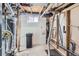 Exposed basement utility area showing framing, pipes, water heater, and electrical components at 101 2Nd St, Fort Lupton, CO 80621