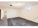 Basement area with vinyl flooring, a window for light, and access to the hallway at 101 2Nd St, Fort Lupton, CO 80621