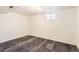 Unfinished basement featuring vinyl flooring, white walls, and a window for natural light at 101 2Nd St, Fort Lupton, CO 80621