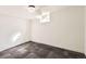 Finished basement room with neutral carpeting, a window, and a light fixture at 101 2Nd St, Fort Lupton, CO 80621