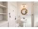 Bathroom with a pedestal sink, a mirror, a shower, and decorative lighting at 101 2Nd St, Fort Lupton, CO 80621