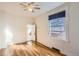 Bright bedroom with hardwood floors, a ceiling fan, and a window with blinds at 101 2Nd St, Fort Lupton, CO 80621