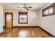 Bright living room featuring hardwood floors, trim details, ceiling fan, and natural light at 101 2Nd St, Fort Lupton, CO 80621