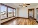 Bright living space featuring hardwood floors, large windows, trim details, and natural light at 101 2Nd St, Fort Lupton, CO 80621