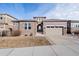 Beautiful home with a stone and siding exterior and an attached two-car garage at 7408 Xenophon St, Arvada, CO 80005