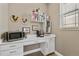 Cozy office nook with built-in desk and shelving, perfect for a home workstation at 7408 Xenophon St, Arvada, CO 80005