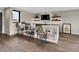 Finished basement with a stylish bar area, great for entertaining with seating for three at 3520 Castle Butte Dr, Castle Rock, CO 80109