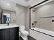 Modern bathroom features a walk-in shower with a glass door and sleek black hardware at 3520 Castle Butte Dr, Castle Rock, CO 80109