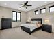 Serene bedroom with neutral tones, dark furniture, and views at 3520 Castle Butte Dr, Castle Rock, CO 80109