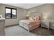 Comfortable bedroom features a full-size bed, natural light, and carpeted flooring at 3520 Castle Butte Dr, Castle Rock, CO 80109
