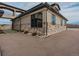 Exterior view of a home featuring stone accents, driveway, and manicured landscaping at 3520 Castle Butte Dr, Castle Rock, CO 80109