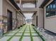 The exterior features a walkway with artificial turf accents and stone walls, blending modern design with natural elements at 3520 Castle Butte Dr, Castle Rock, CO 80109